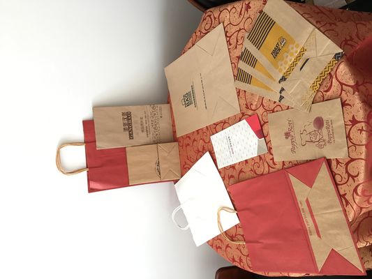 लक्जरी मुद्रित हैंडल वैक्स पेपर बैग आभूषण पैकेजिंग ग्रीसप्रूफ